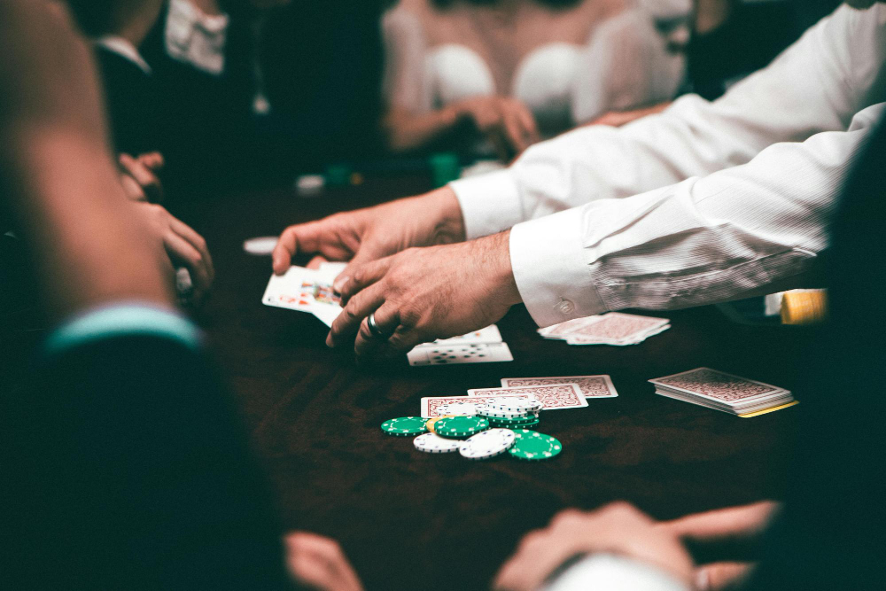 Cards dealer showing cards at a poker game